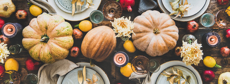 A table decorated for Thanksgiving holiday