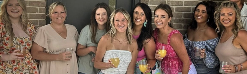 Group of ladies enjoying brunch and bottomless mimosas at UP on the Roof