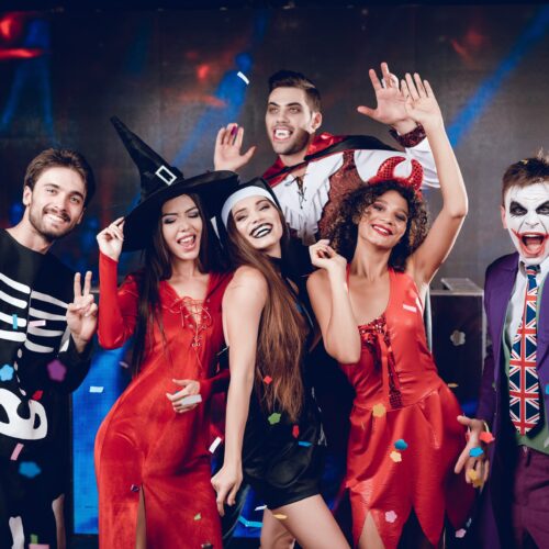 Group of friends in Halloween costimes at a party