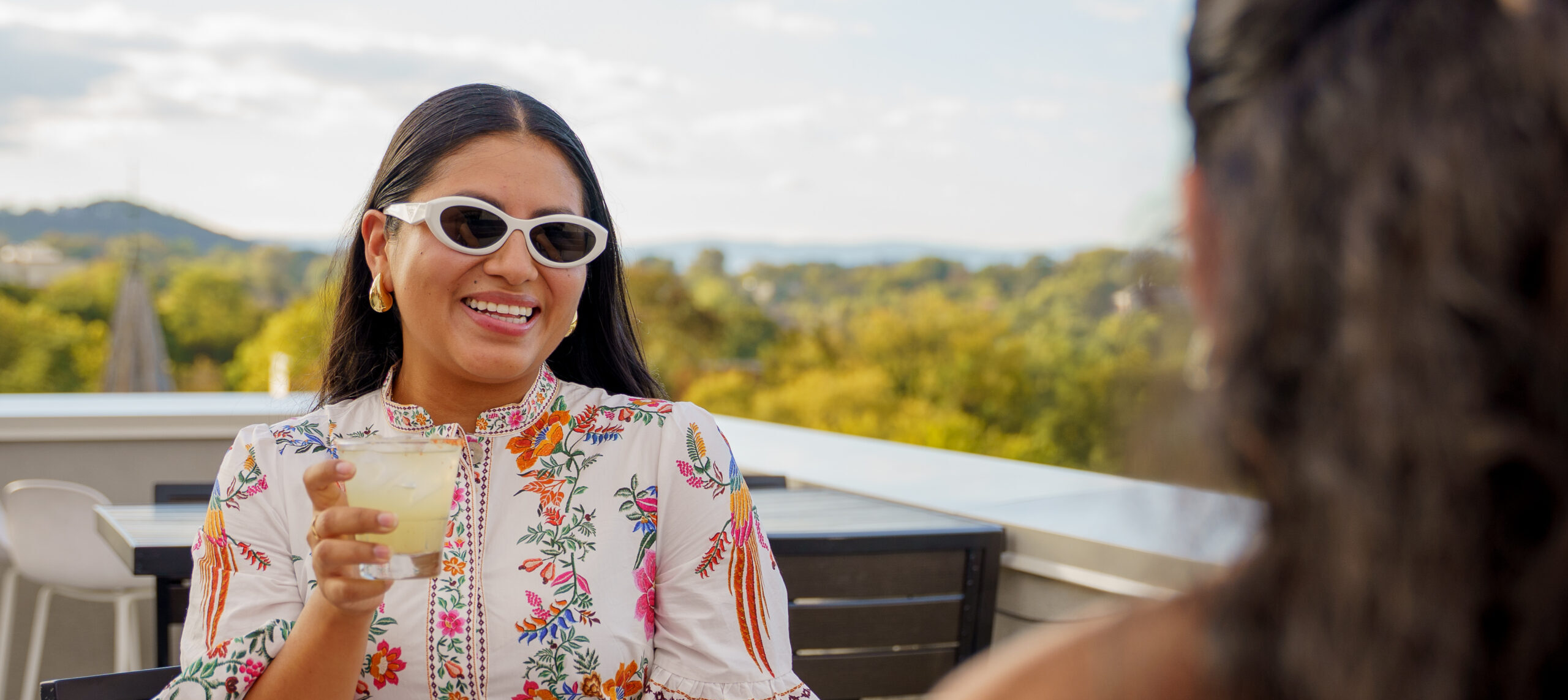Woman celebrating on the Charlottesville Rooftop