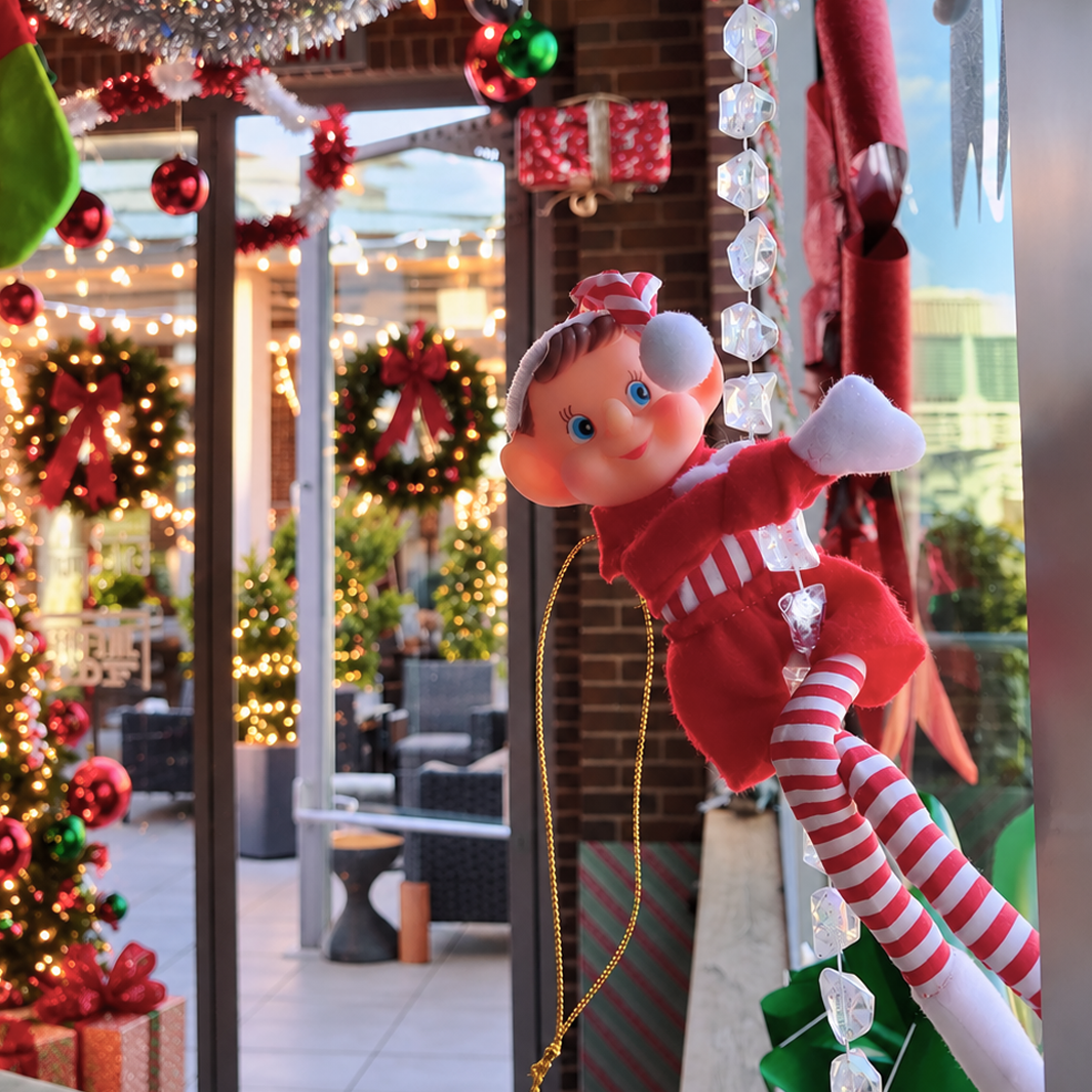 Elf dangling from the decor at UP on the Roof Anderson