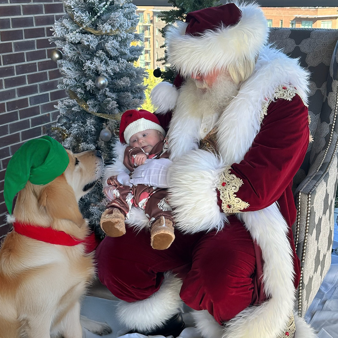 Santa with baby and dog at UP Greenville