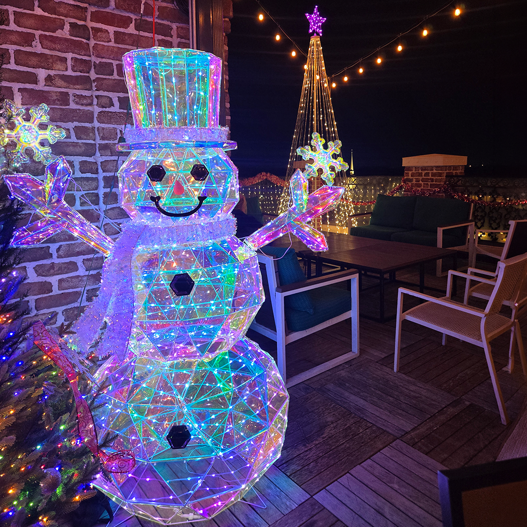 A lit snowman on the Alpharetta rooftop at UP on the Roof Elf'd UP holiday pop-up